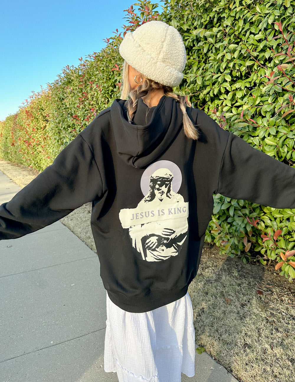 Elevated Faith Christian Hoodie in black featuring 'Jesus is King' graphic on the back