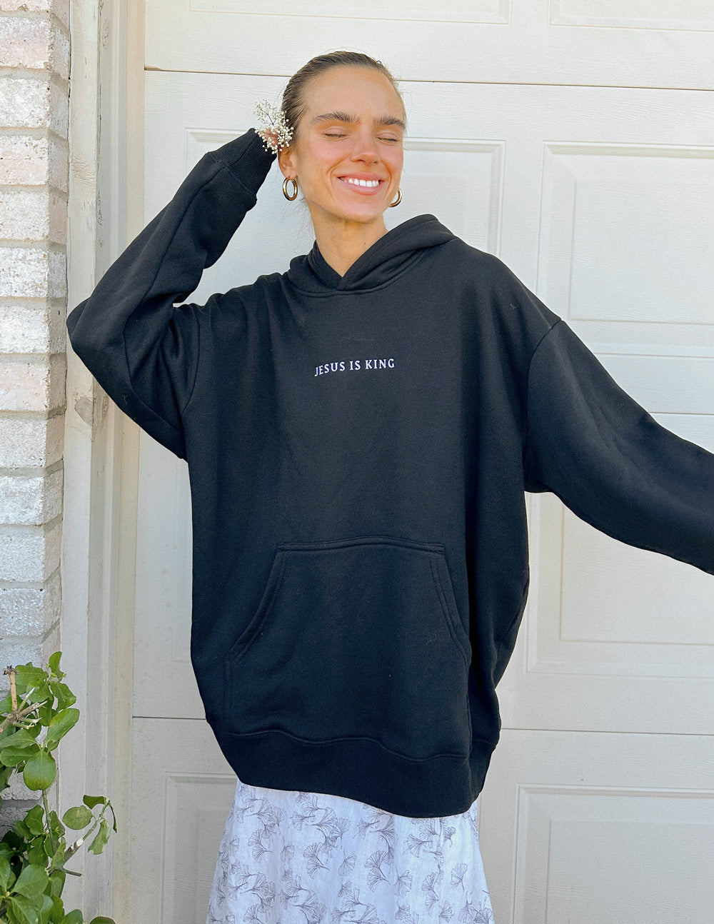 Elevated Faith Christian Hoodie in black featuring 'Jesus is King' design for stylish comfort