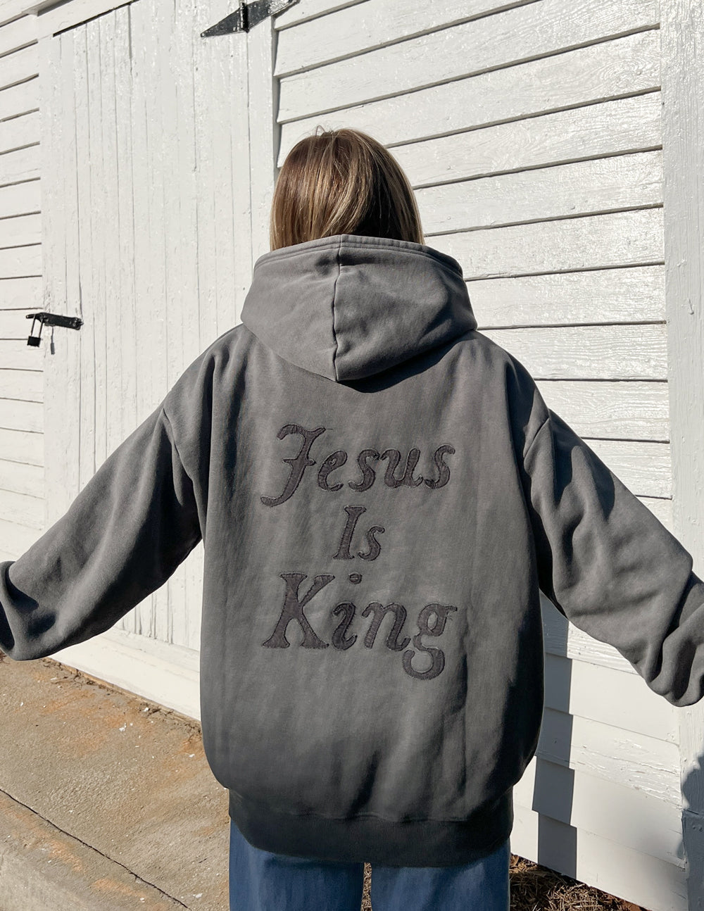 Elevated Faith Christian Hoodie in gray featuring 'Jesus Is King' text on the back