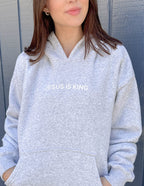 Elevated Faith Christian Hoodie in gray with 'JESUS IS KING' text on the front