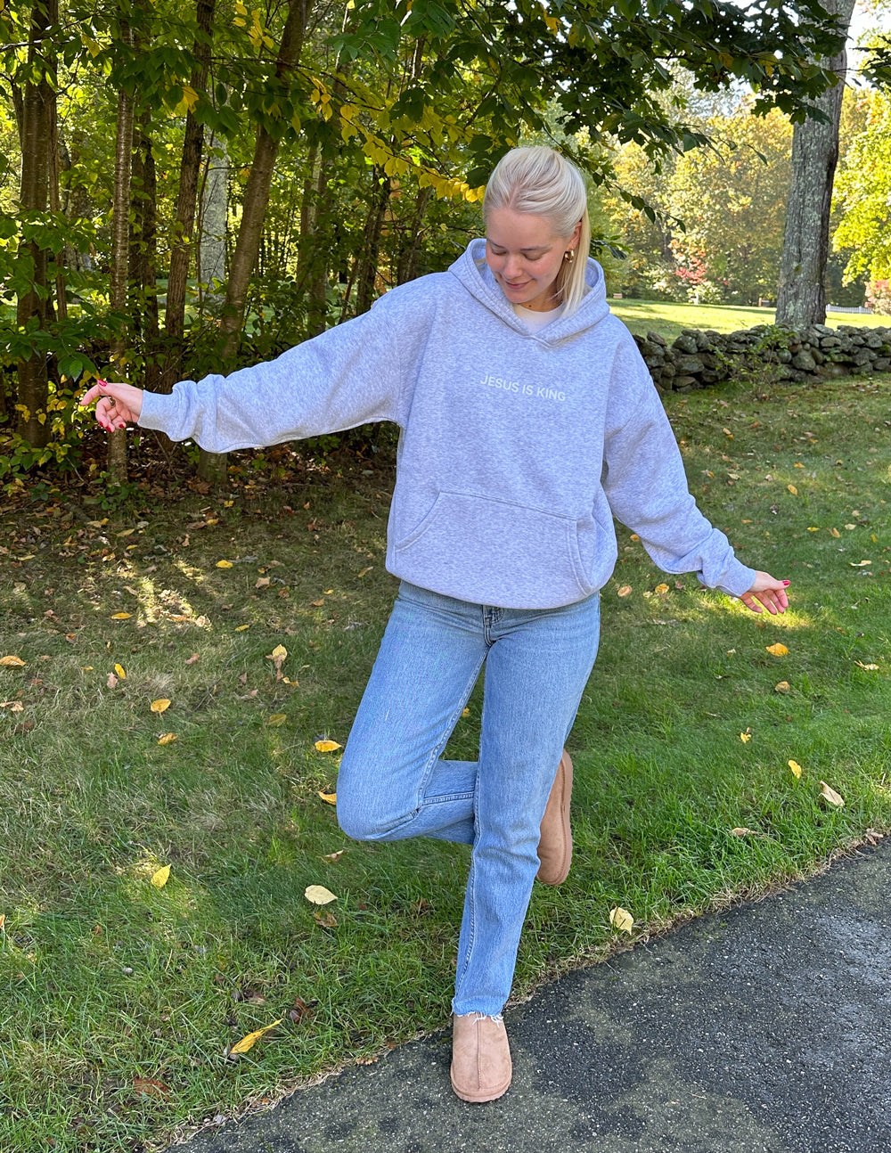 Elevated Faith Christian Hoodie in Gray, worn with jeans, perfect for casual outdoor wear
