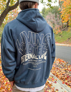 Elevated Faith Christian Hoodie in navy featuring 'Living Water Eternal Life' graphic on the back
