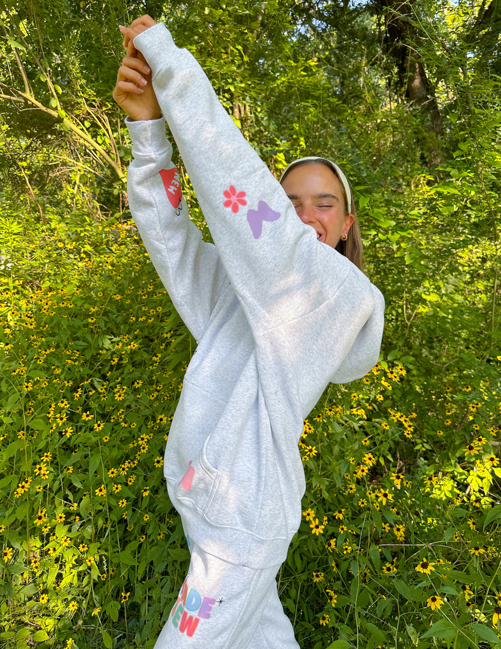 Elevated Faith Christian Hoodie in light gray with colorful floral designs and relaxed fit for casual wear