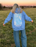 Blue Elevated Faith Christian Hoodie with Miracles graphic on the back, perfect for casual wear