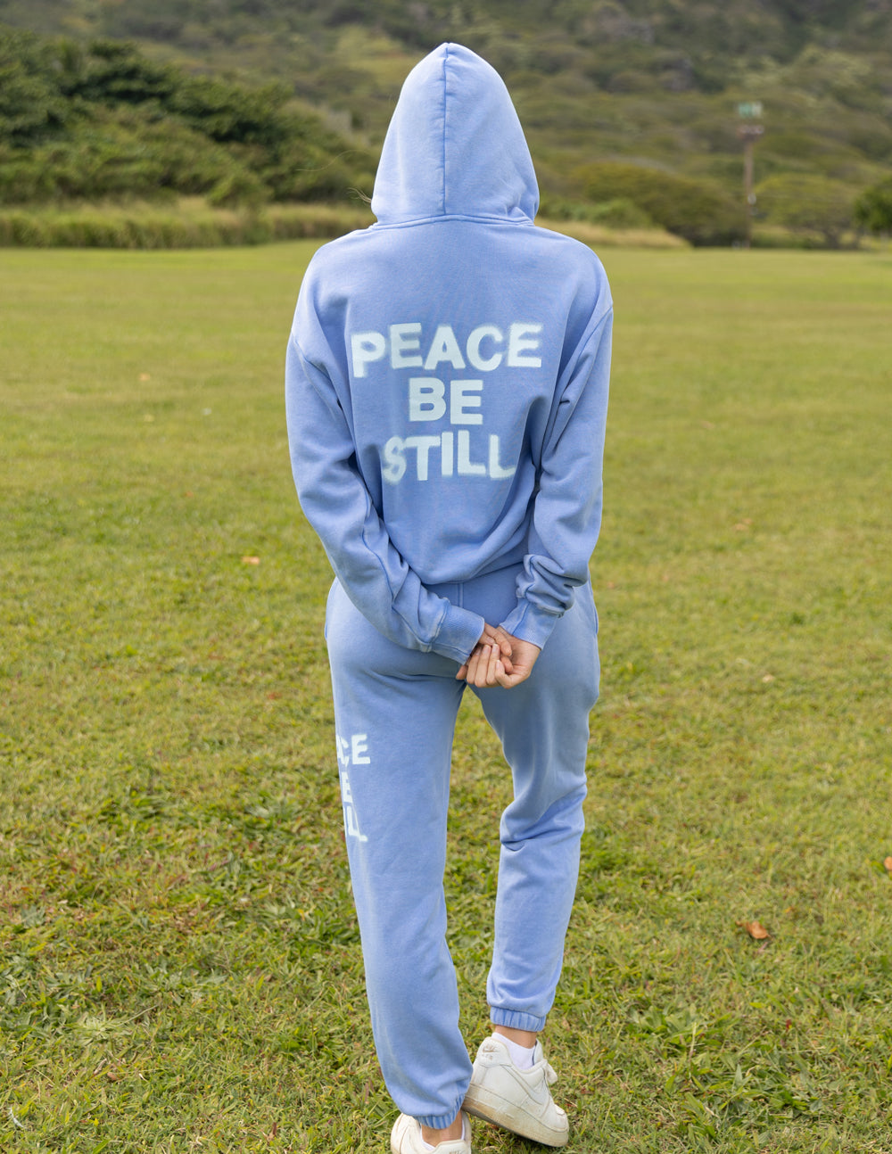 Light blue Christian Hoodie with 'Peace Be Still' print for a stylish, faith-inspired look