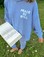 Light blue Christian Hoodie from Elevated Faith with 'Peace Be Still' text perfect for casual wear