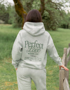 Elevated Faith Christian Hoodie in Soft Green with Perfect Love Design for Casual Comfort