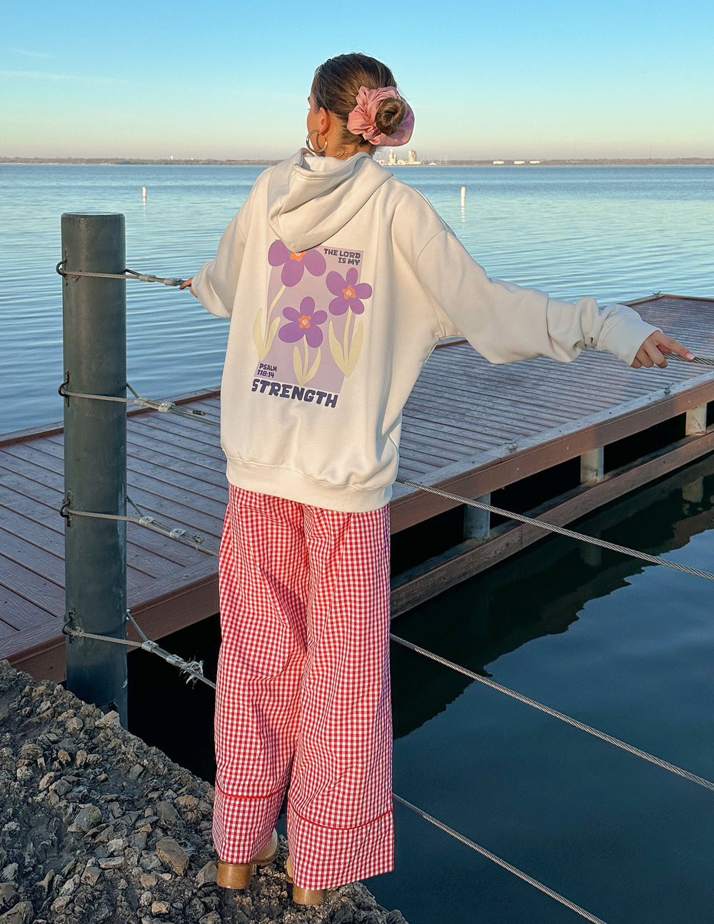Elevated Faith Christian Hoodie in white with floral design and the word Strength, perfect for casual wear