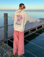 Elevated Faith Christian Hoodie in white with floral design and the word Strength, perfect for casual wear