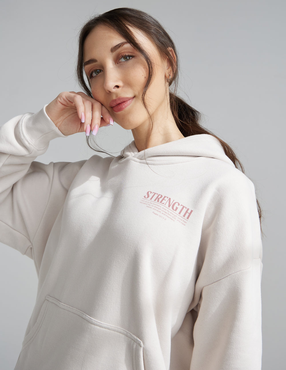 Elevated Faith Christian Hoodie in Light Beige with Strength Graphic and Front Pocket