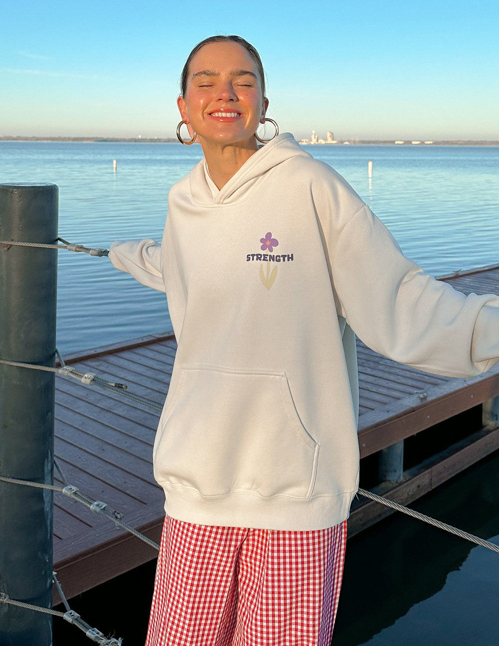 Elevated Faith Christian Hoodie in White with Floral Design and 'Strength' Text Featured