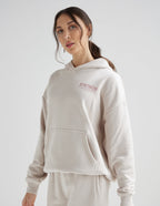 Elevated Faith Christian Hoodie in soft beige with 'STRENGTH' embroidery on the front.