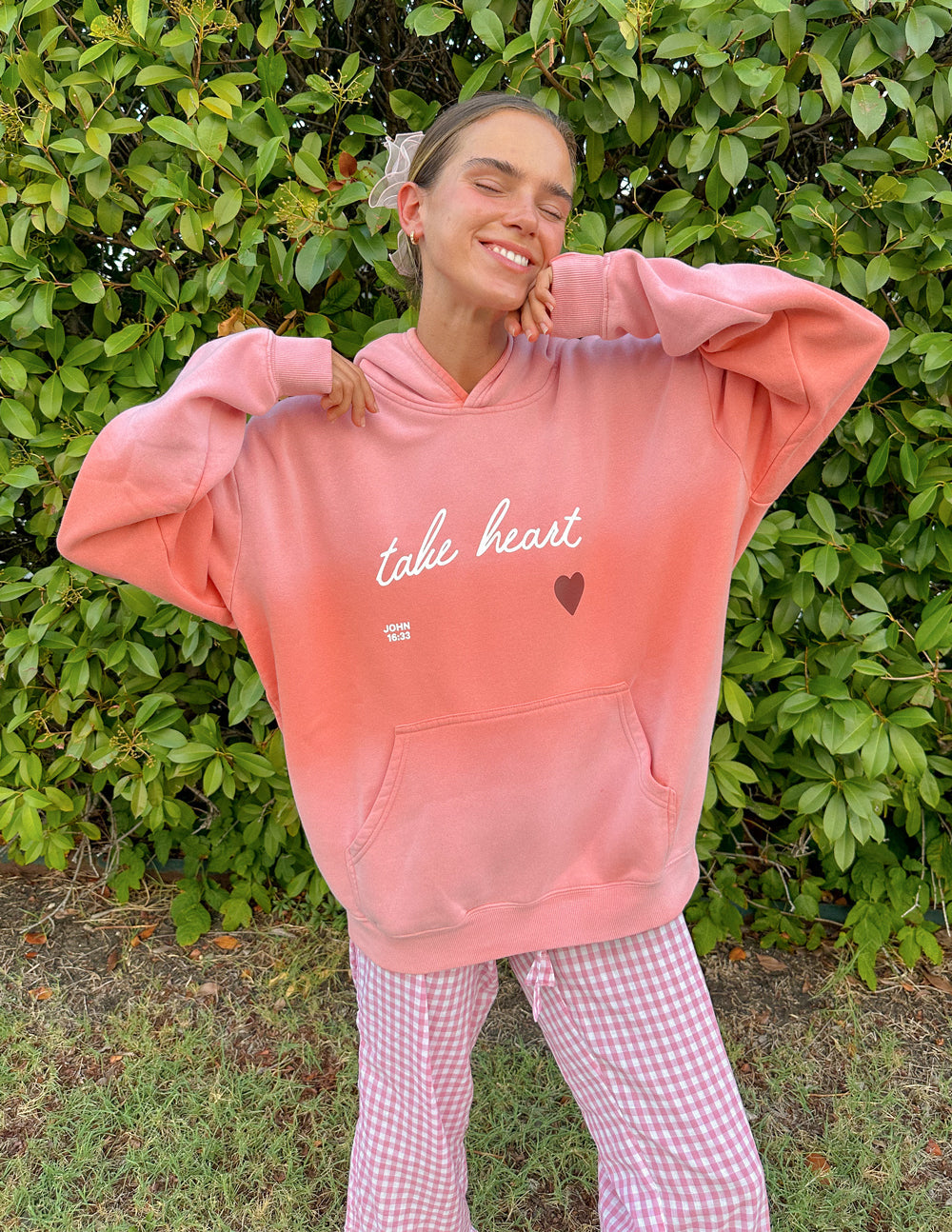 Elevated Faith Christian Hoodie in pink with inspirational 'take heart' design and front pocket
