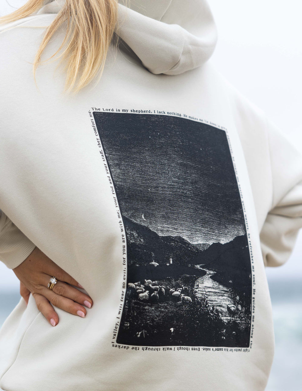 Elevated Faith Christian Hoodie featuring serene graphic design with a landscape and inspirational text on the back