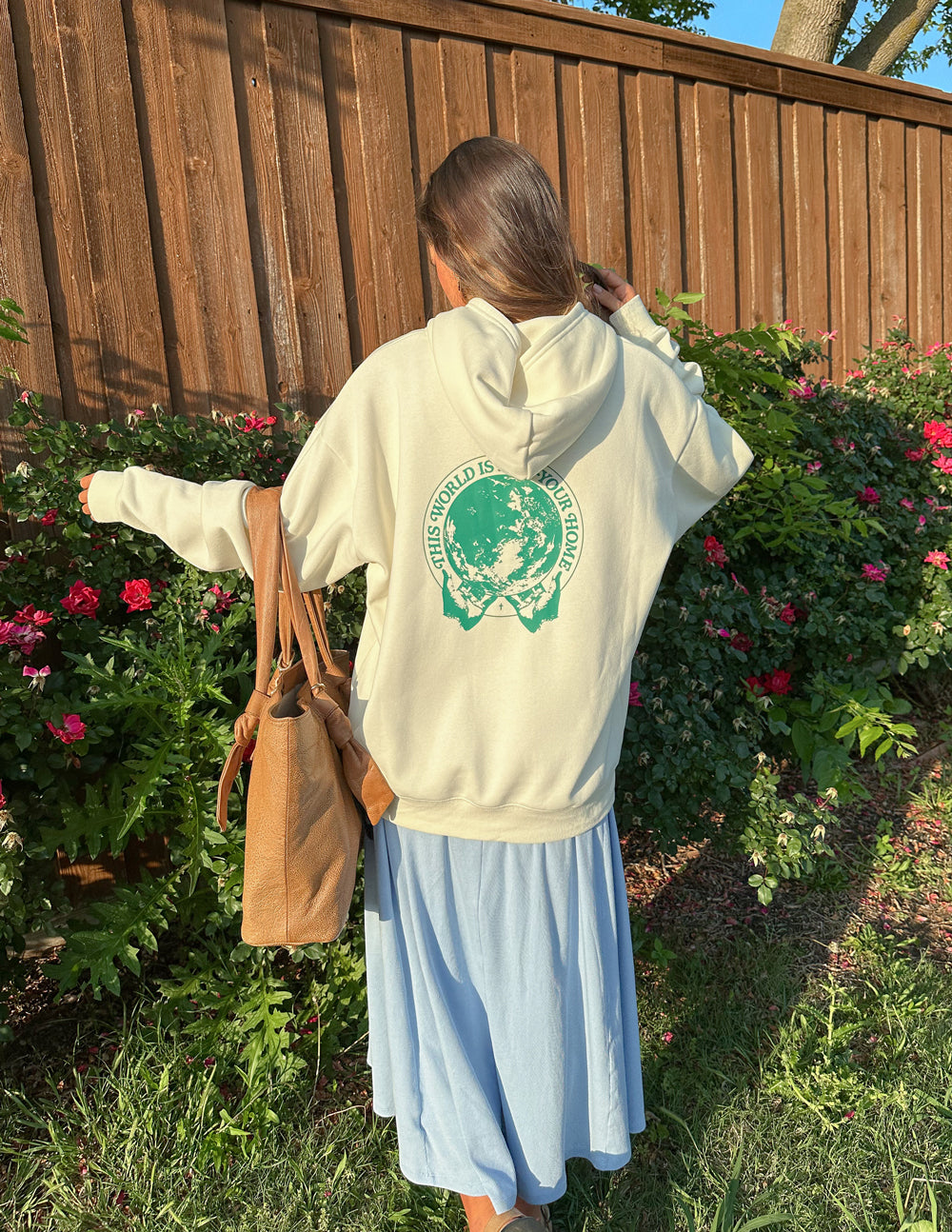 Elevated Faith Christian Hoodie in cream with a green graphic design on the back