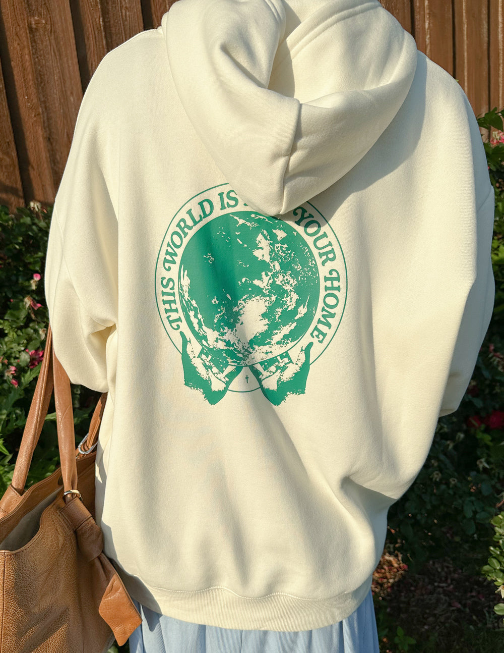 Elevated Faith Christian Hoodie in Cream with Earth Graphic and Inspirational Message on Back