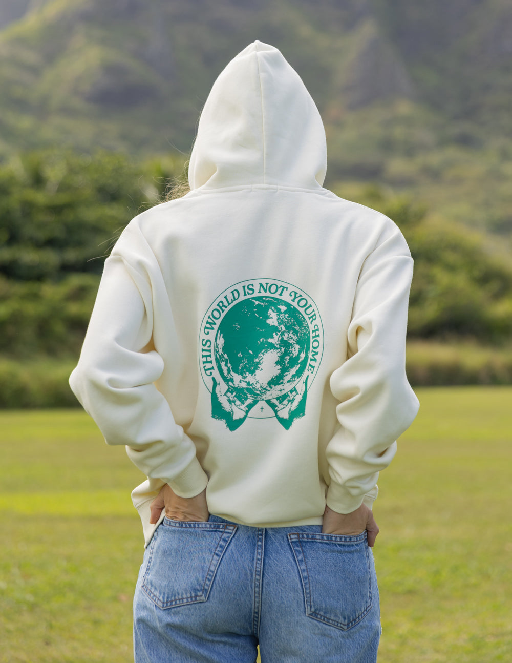 Elevated Faith Christian Hoodie in cream with world graphic on the back for a stylish statement