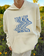 Elevated Faith Christian Hoodie in Cream with Blue Text 'Your Love Never Fails' Design