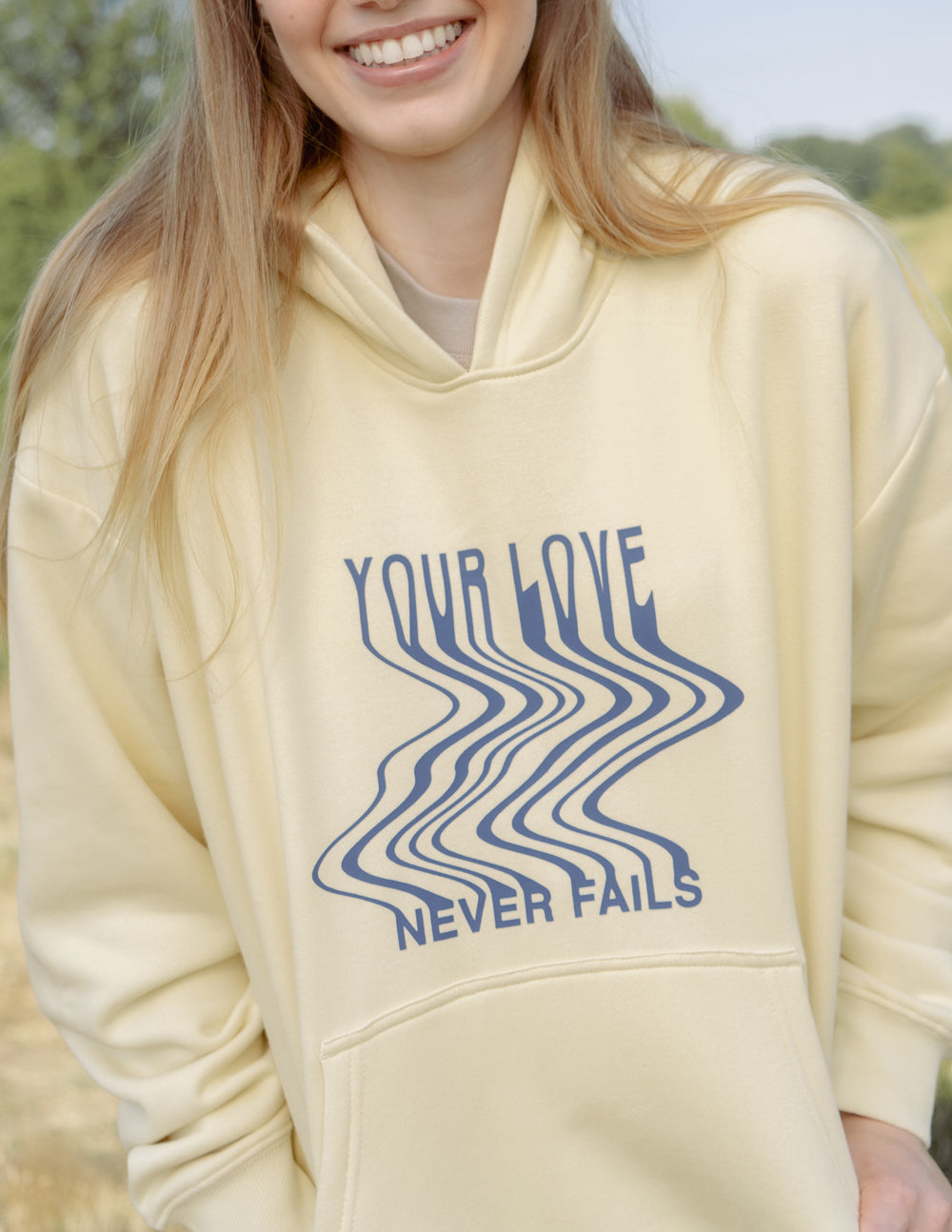 Elevated Faith Christian Hoodie in Soft Yellow with 'Your Love Never Fails' Design
