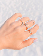 Collection of Elevated Faith Christian Jewelry Rings displayed on a hand with multiple styles