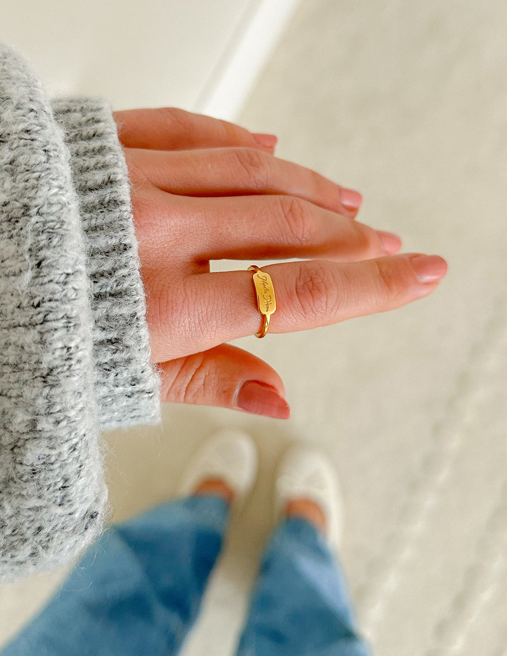 Gold Elevated Faith Ring on hand, perfect example of elegant Christian Jewelry