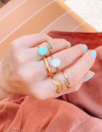 Stylish Christian Jewelry rings in gold, featuring unique designs and colorful gemstones