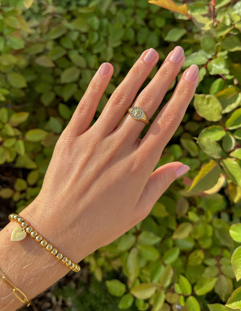 Gold ring on a hand showcasing elegant design, perfect for Christian Jewelry enthusiasts