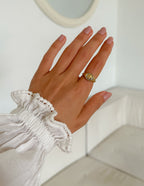 Elevated Faith Gold Ring featuring Christian Jewelry with a unique design on a hand in a white setting