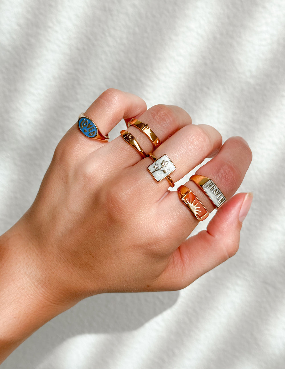 Collection of Elevated Faith rings showcasing unique designs, perfect for Christian jewelry enthusiasts