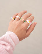 Colorful beaded rings displayed on a hand, showcasing Elevated Faith Christian Jewelry style