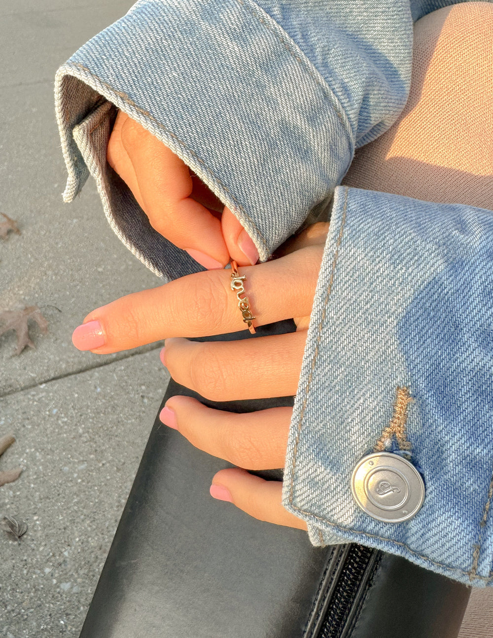 Elevated Faith Christian Jewelry Ring Worn on Hand with Denim Jacket for Faith-Inspired Style