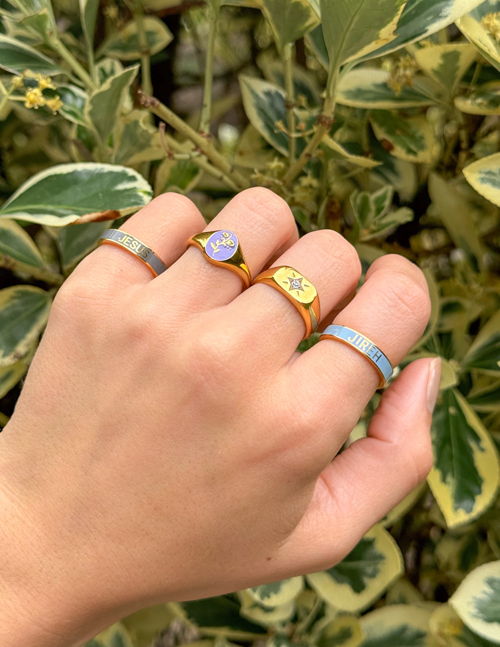 Multiple elevated faith rings featuring colorful designs, perfect examples of Christian Jewelry
