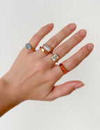 Set of Elevated Faith Christian Jewelry Rings on a model's hand with various designs
