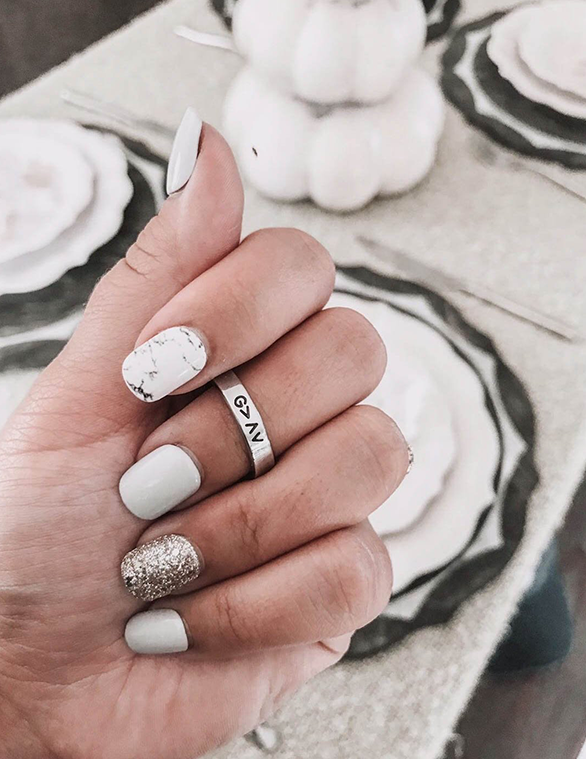 Elevated Faith Christian Jewelry Ring on manicured hand with gray and glitter nails