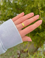 Gold Elevated Faith Ring on hand, showcasing stylish Christian Jewelry for everyday wear