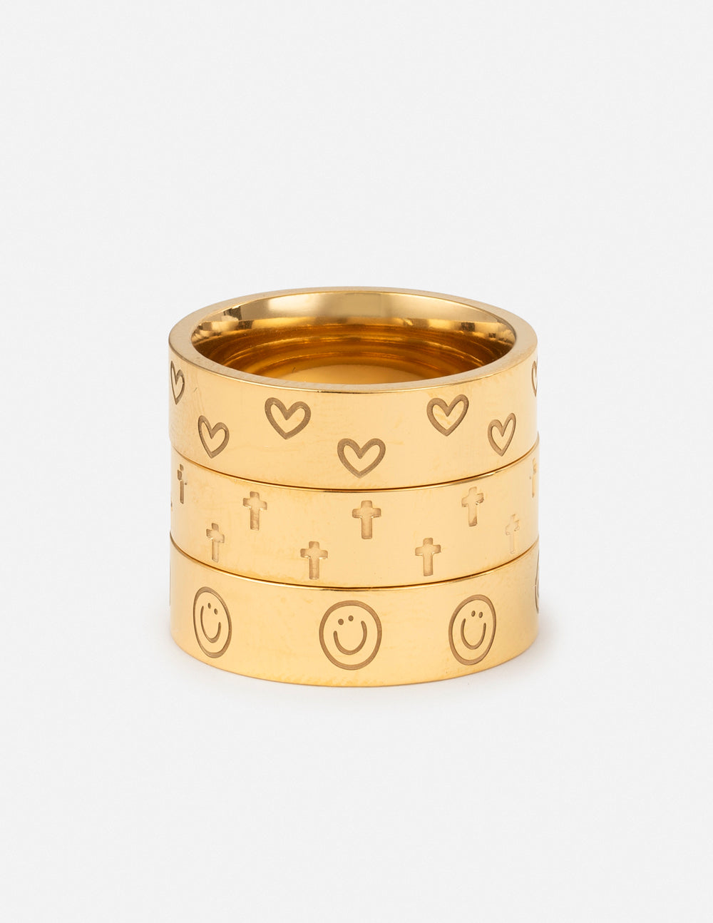 Set of three gold rings featuring hearts and crosses as Christian Jewelry by Elevated Faith