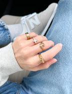 Three stylish rings featuring a cross and leaf design, perfect as Christian Jewelry accessories