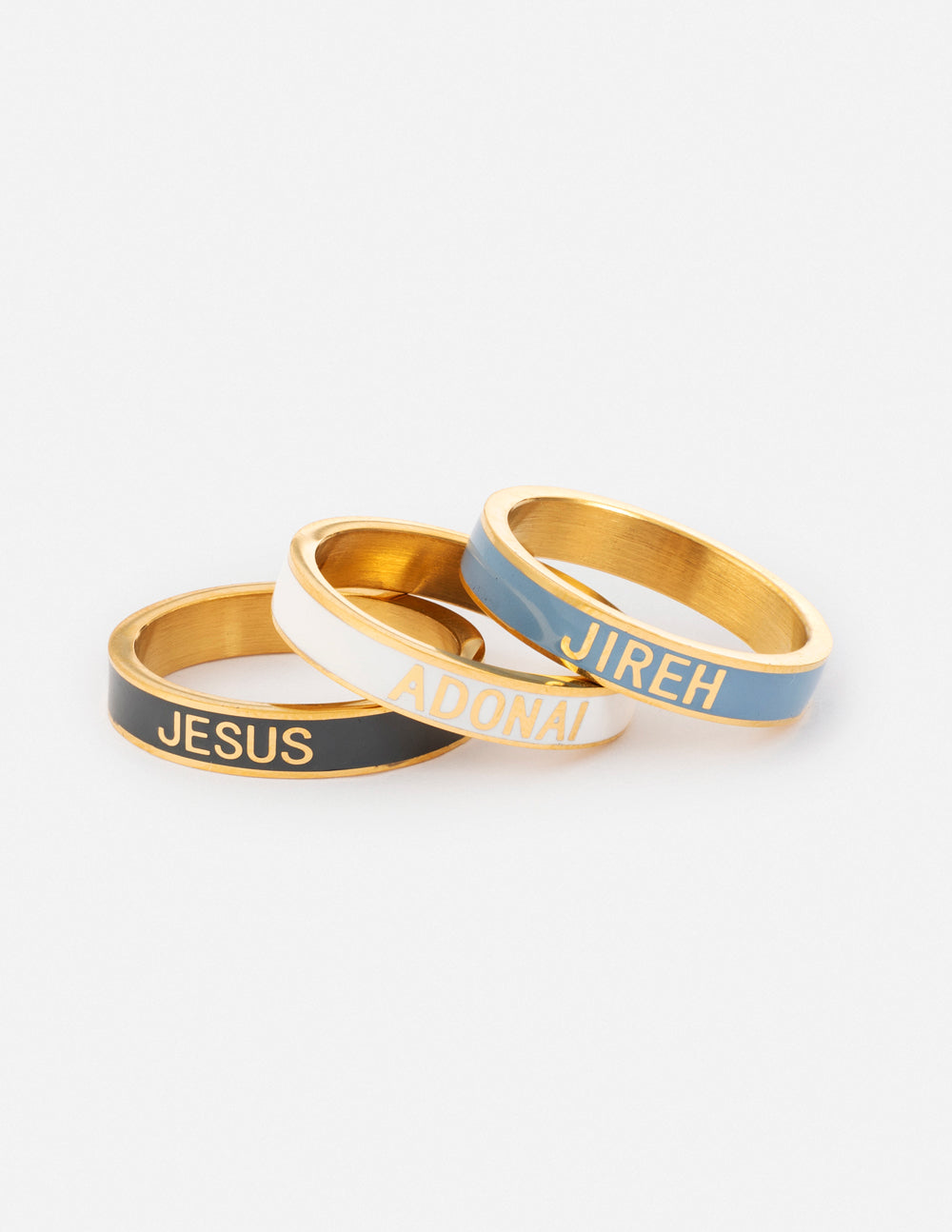 Set of three Elevated Faith Christian Jewelry rings featuring the words Jesus, Adonai, and Jireh