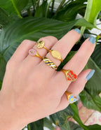 Collection of Elevated Faith rings featuring colorful designs, perfect for Christian jewelry enthusiasts