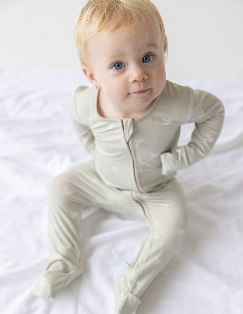 Elevated Faith Christian Kids Apparel onesie in light beige with zip front and footed design for comfort