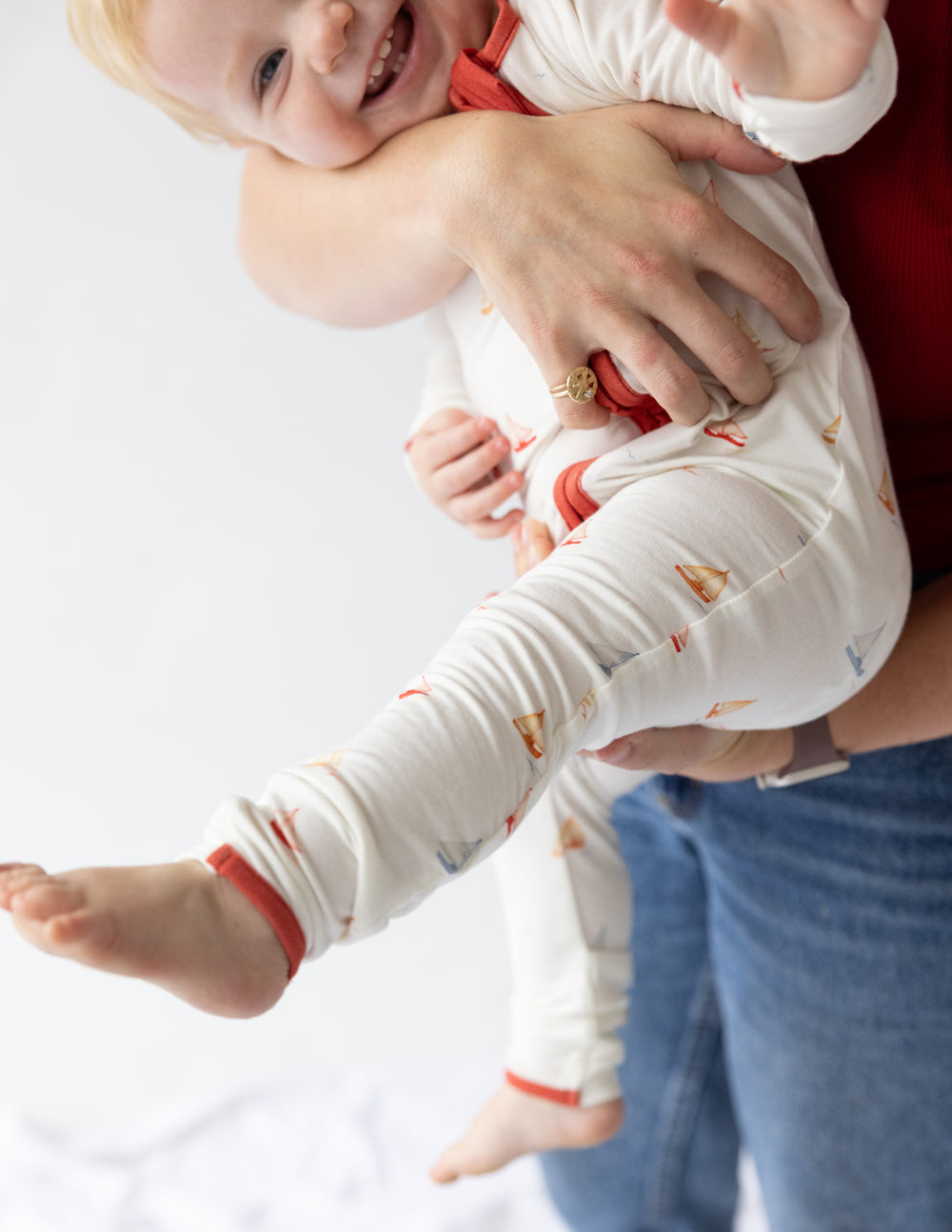 Baby wearing a cozy onesie from Elevated Faith, featuring Christian Kids Apparel with playful designs