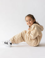 Beige kids sweatpants from Elevated Faith featuring cozy design for stylish Christian Kids Apparel