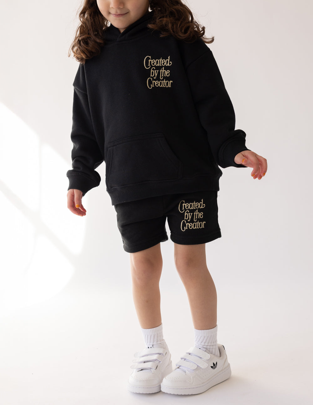 Elevated Faith Christian Kids Apparel featuring black shorts with 'Created by the Creator' text