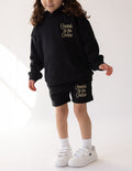 Elevated Faith Christian Kids Apparel featuring black shorts with 'Created by the Creator' text