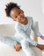 Cute girl in light blue kids pajamas with cloud pattern, part of Christian Kids Apparel collection