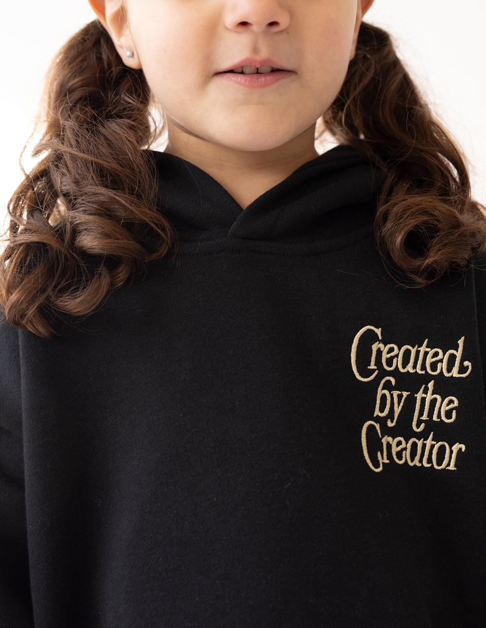 Black Kids Hoodie from Elevated Faith featuring 'Created by the Creator' design for Christian Kids Apparel