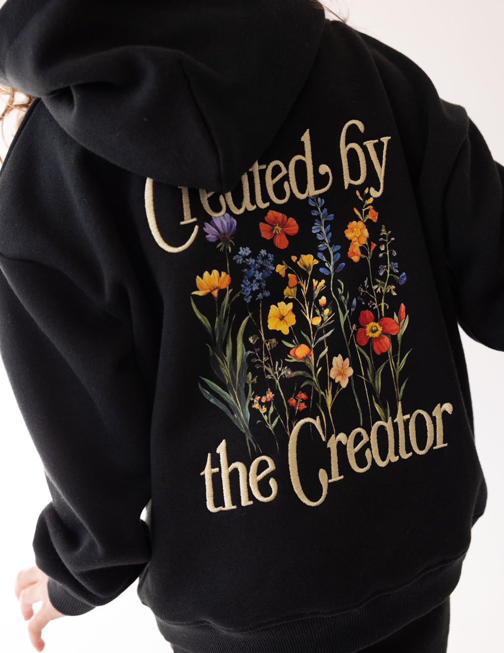 Black Kids Hoodie with Floral Design and 'Created by the Creator' Text for Christian Kids Apparel