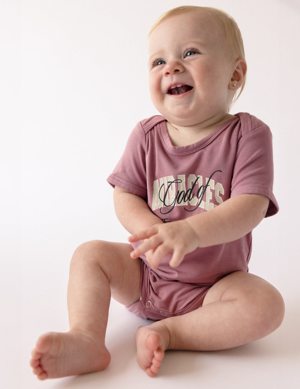 Elevated Faith Christian Kids Apparel Onesie in Dusty Rose Featuring Fun God’s Love Design