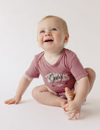 Elevated Faith Onesie for infants featuring Christian Kids Apparel design in soft pink