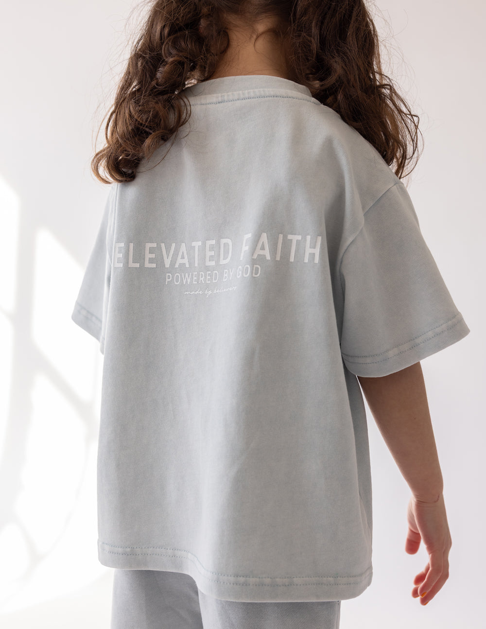 Elevated Faith Kids T-Shirt in Light Gray with Christian Kids Apparel design on the back